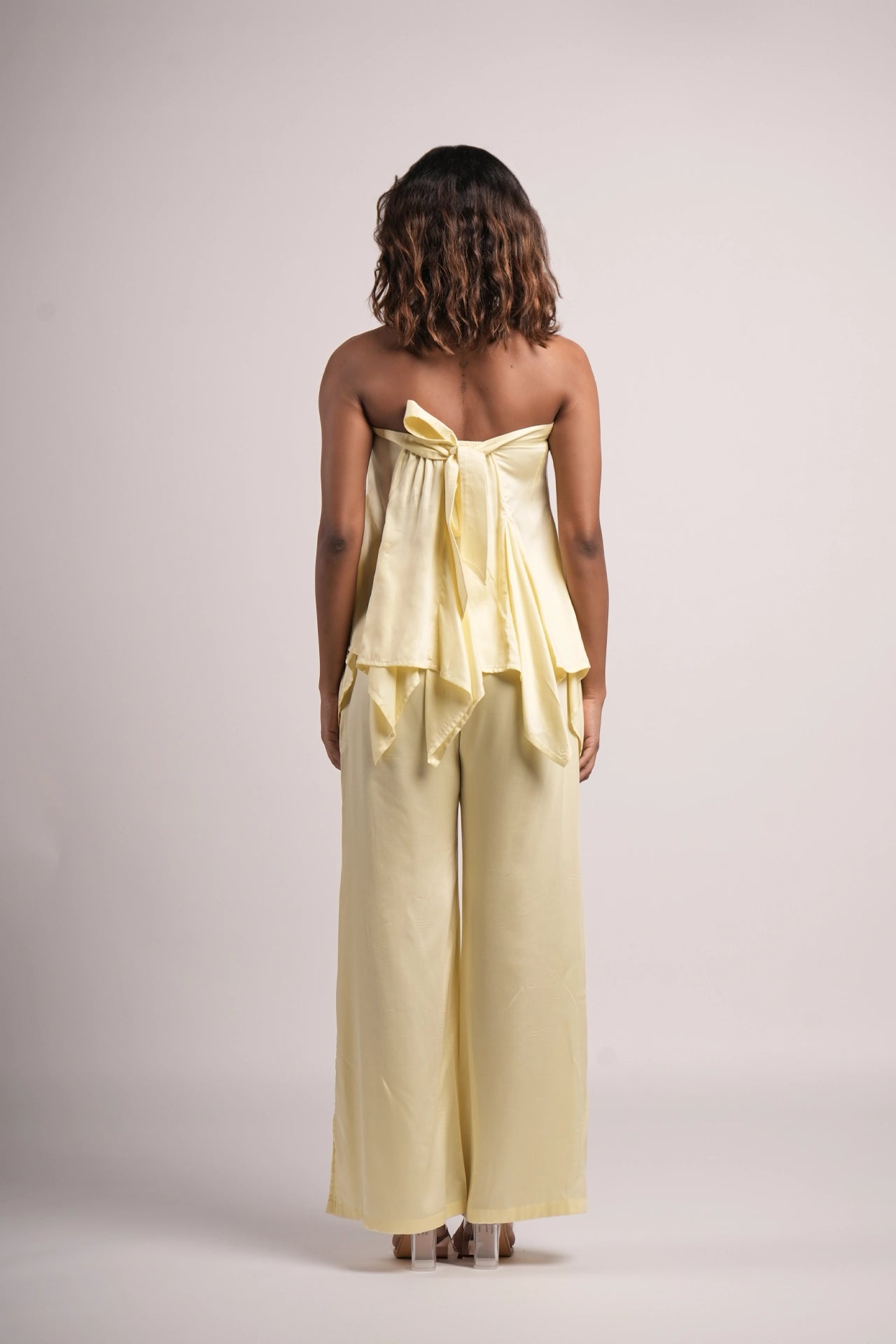 Butter yellow co-ord set worn for brunch — satin tube top and flowing trousers women India Label WildChild