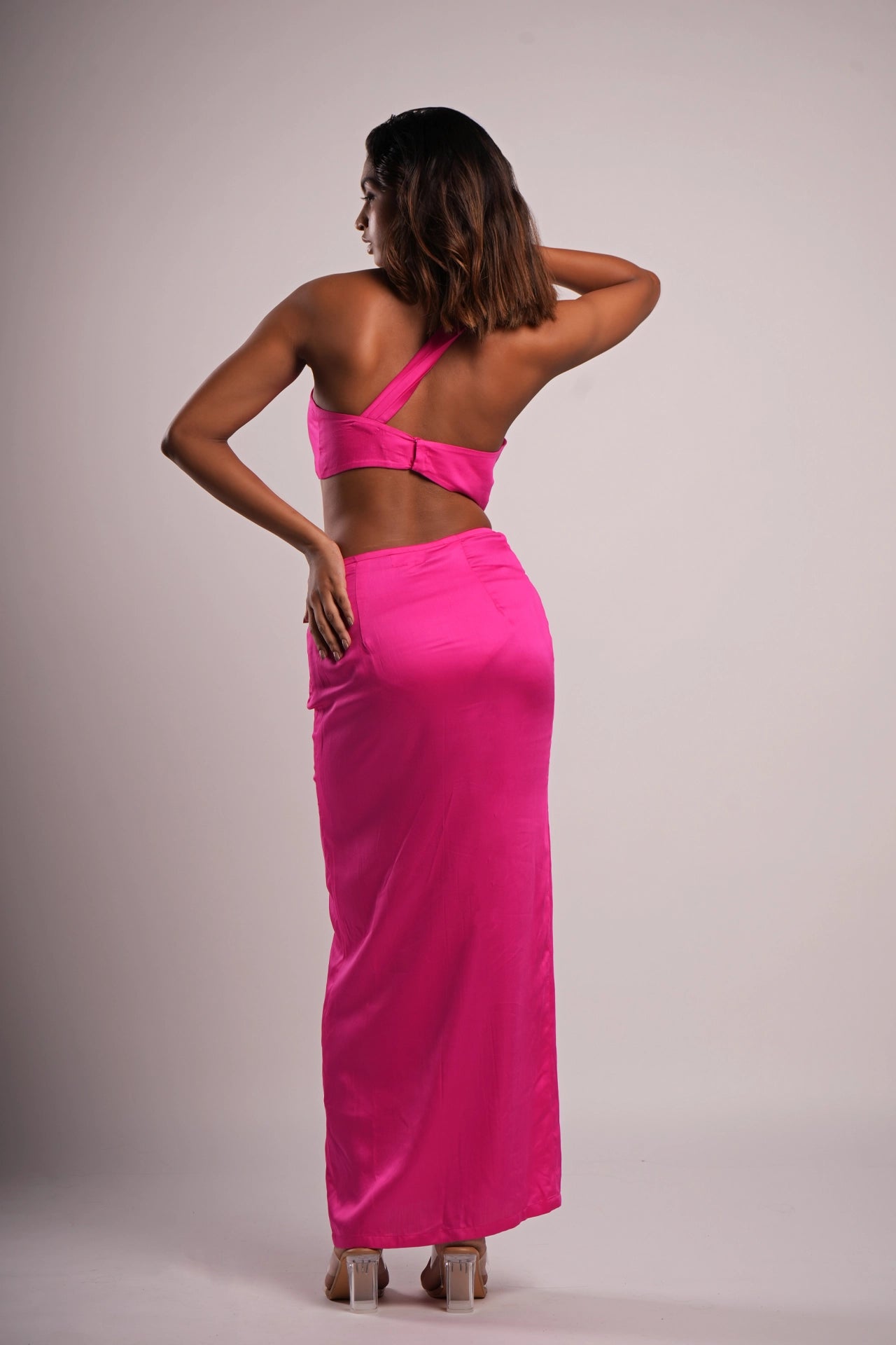 Back view of rani pink satin co-ord set — asymmetric neckline crop top India